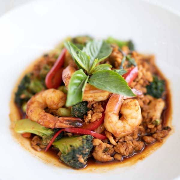 Thai basil stir-fry with shrimp, ground chicken, broccoli, and red bell peppers.