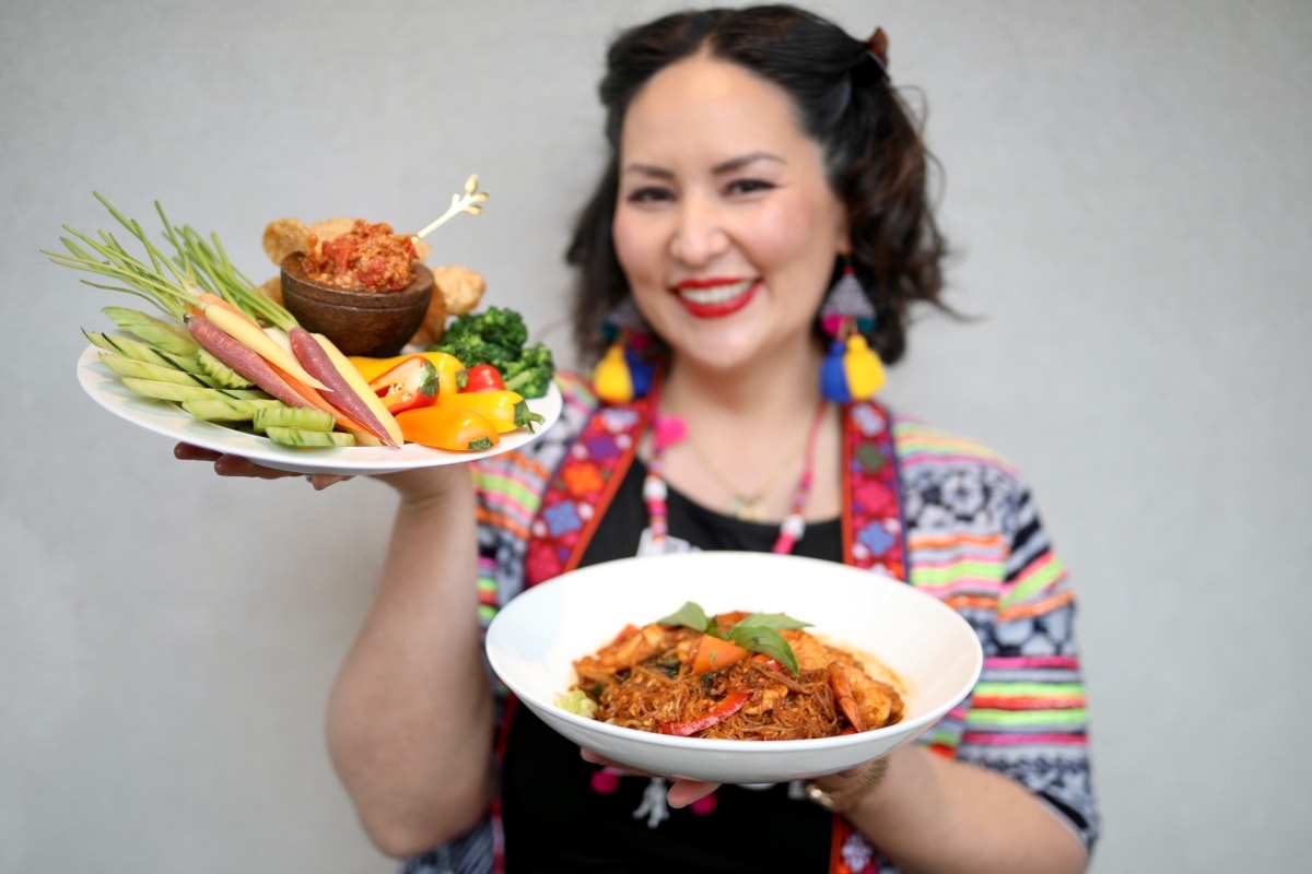 woman holding thai food