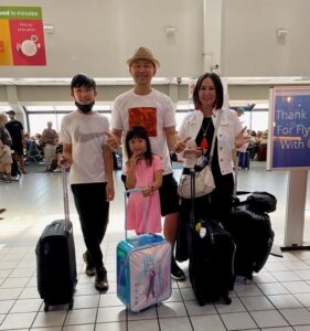 Family at the airport heading on Summer Vacation